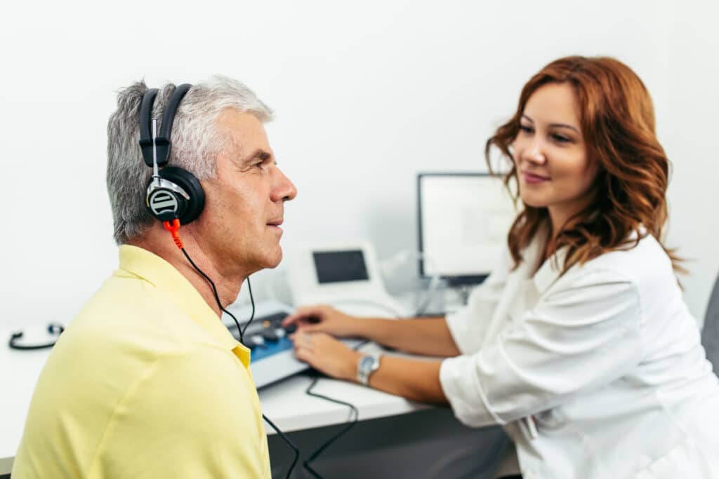 Hearing and cognitive decline: an older man gets a hearing test