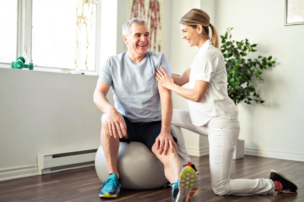 Parkinson’s Exercise Programs: A man works with a physical therapist
