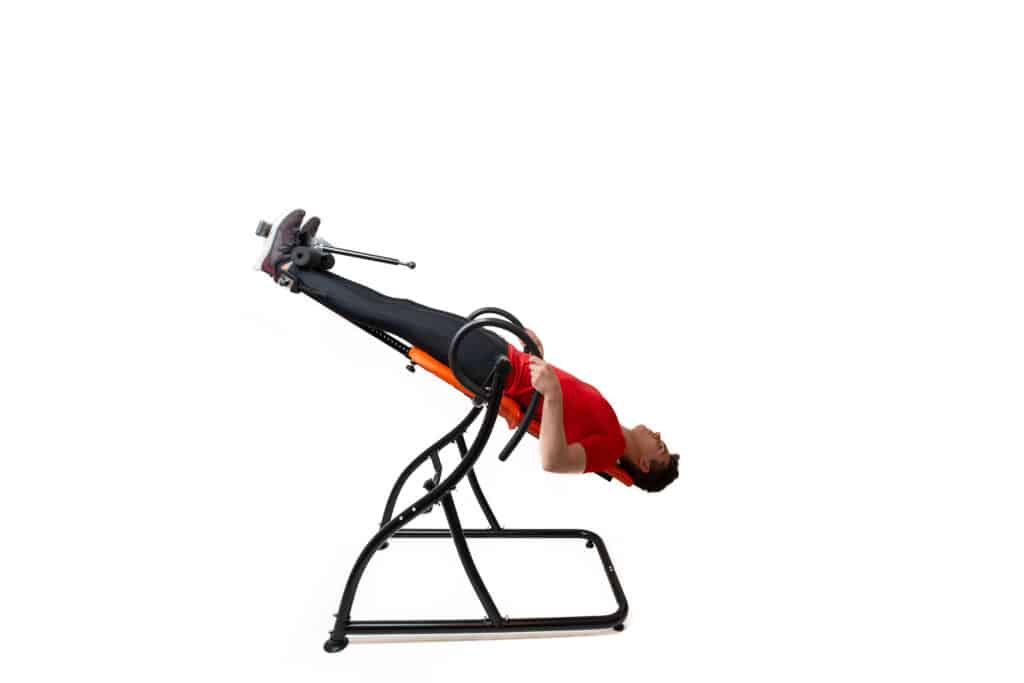 Image of a man on an inversion table for spinal decompression
