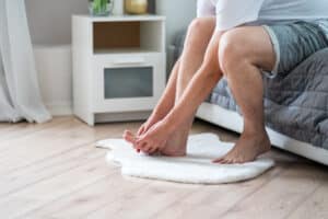 Image of a man suffering from gout foot pain