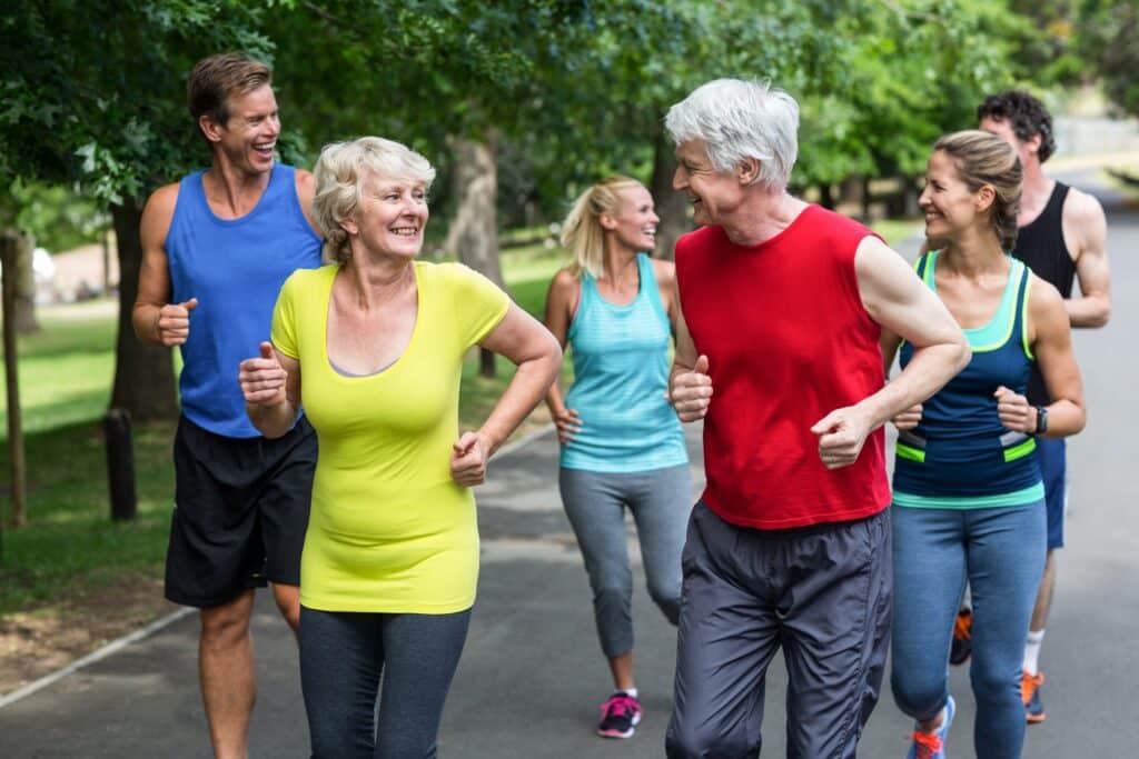 How To Tell If You Are Out of Shape & What to Do About It: image of a group of seniors running together in a position 5k race