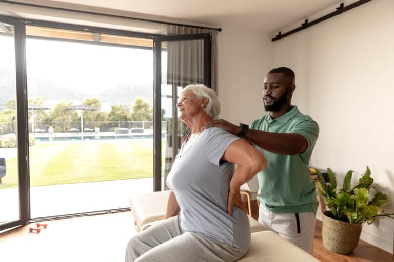 MASH treatment: Image of a manual therapist working with a patient with low back and hip pain