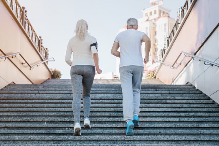 Building Bone Density Naturally: The Guide to Weight-Bearing Exercises: a healthy older couple jogs together