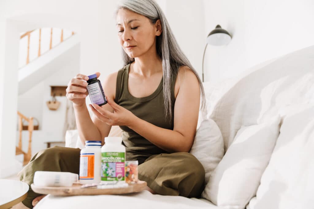 An older woman examines various supplements for joint health