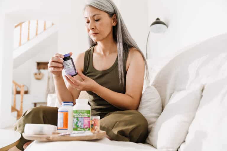 An older woman examines various supplements for joint health