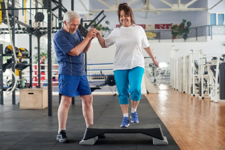 Hearing and balance: image of a senior couple working out in the gym