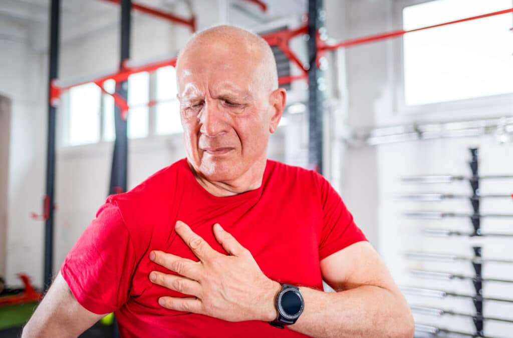 Image of a senior man with shoulder pain in the gym.