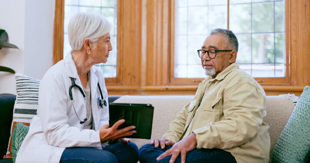 Image of an older Hispanic man discussing stem cell treatment for arthritis