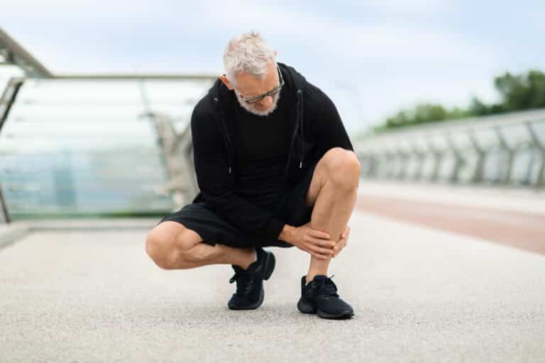 Image of a man with shin pain from stress fractures