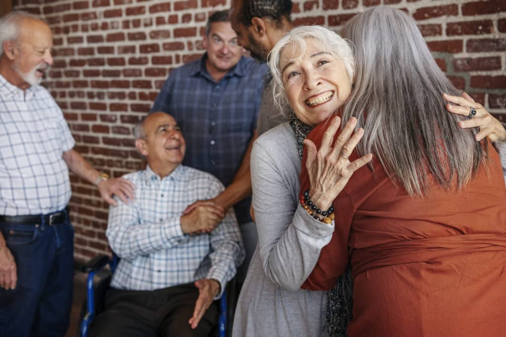 REM sleep disorder and Parkinson's: a happy group of seniors at a support group gathering