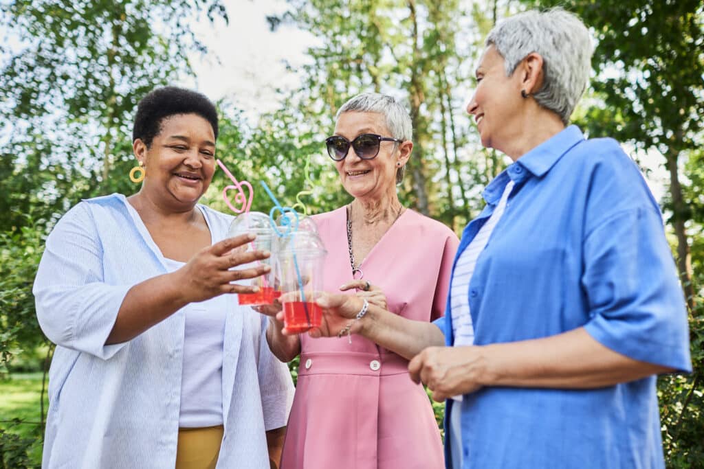 Menopause and joint pain: image of three senior women enjoying time outdoors together