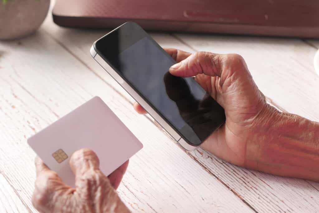 How to Use Uber and Other Rideshare Services: A Senior Woman inputs her credit card information on her smartphone