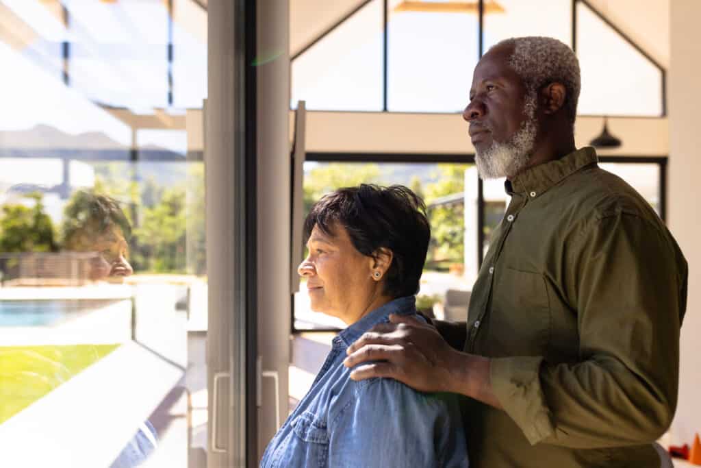 REM sleep disorder and Parkinson's: a couple gazes out the window contemplatively after a diagnosis