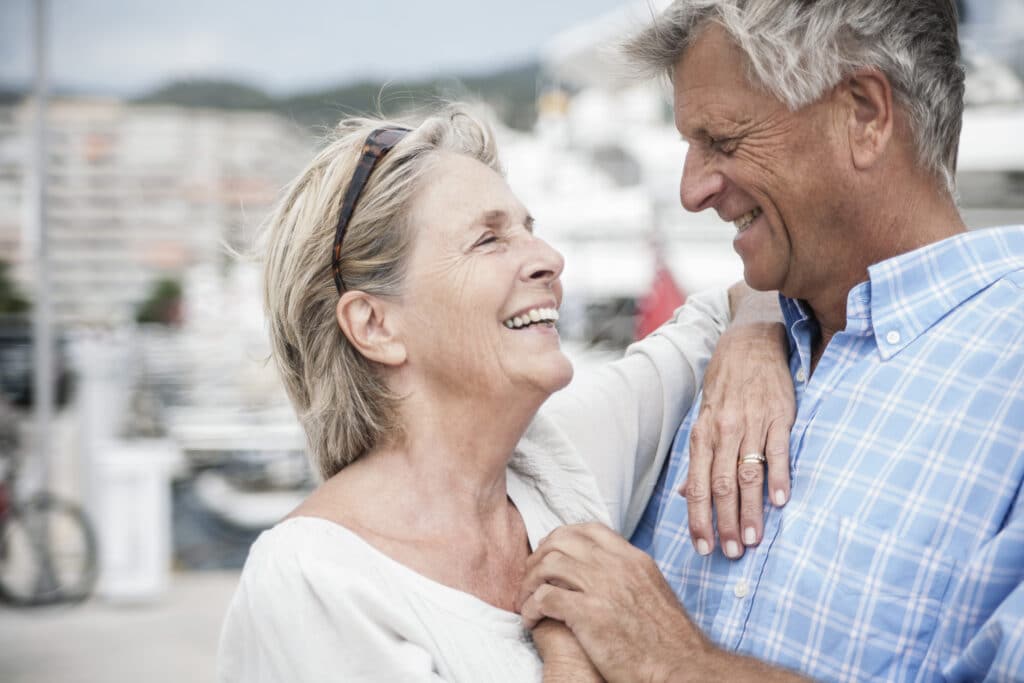 Image of a happy couple without shoulder pain at the beach